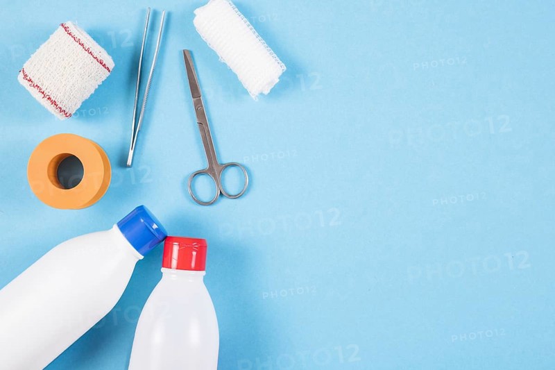 Overhead view wound dressing medical equipments blue background