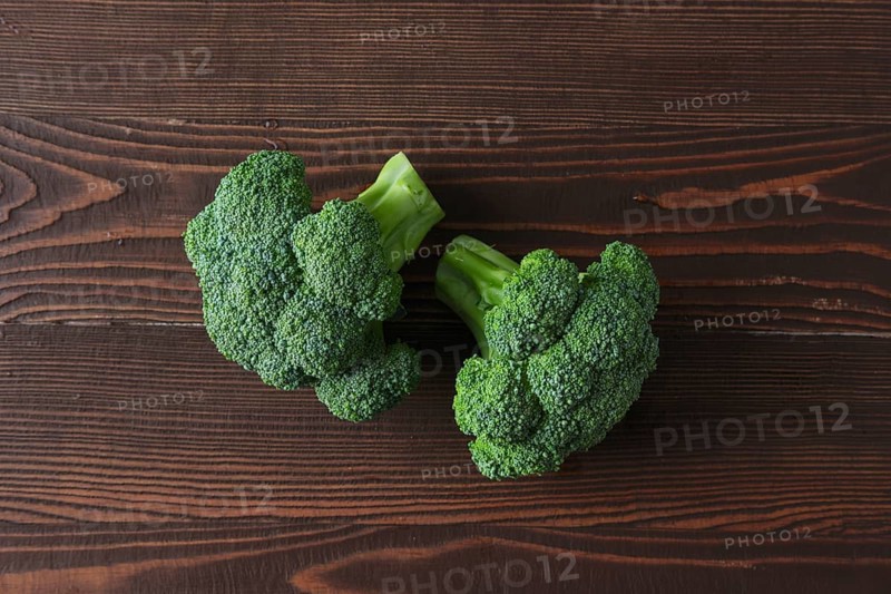 Broccoli on dark wooden background