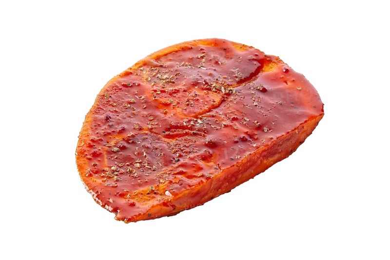Raw piece of meat with spice and sauce prepered for barbecue. Gastronomy template isolated on white background