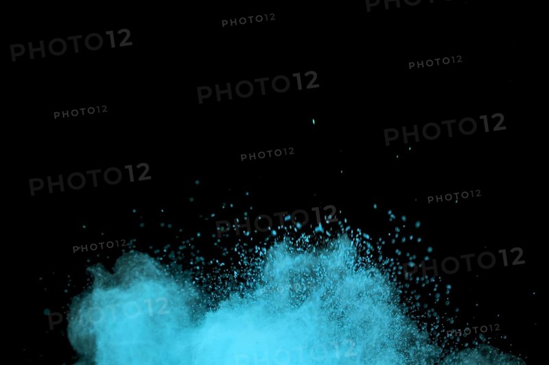 Flying blue colored dust particles