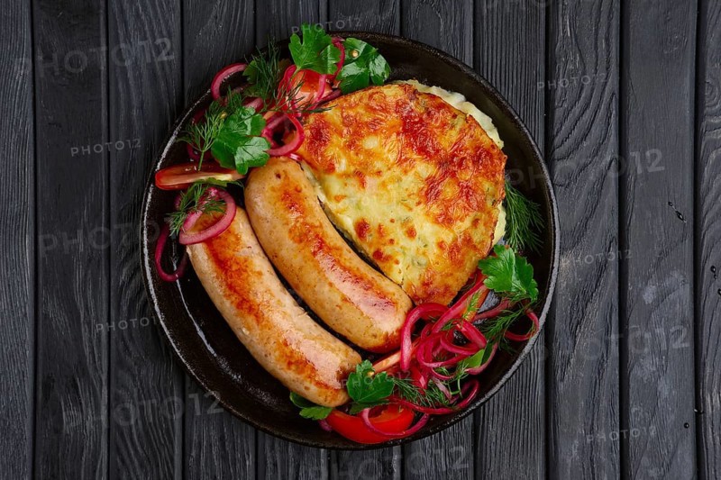 Fried homemade sausage with fried mashed potato