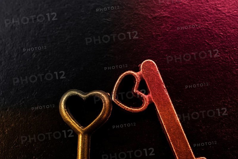 Heart shaped retro metal keys on dark background