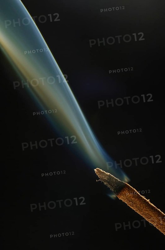 Trajectory of incense smoke in the air showing different shapes. France