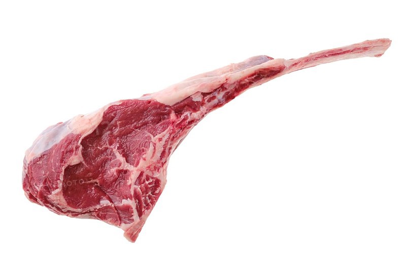 Overhead view of raw beef cowboy steak