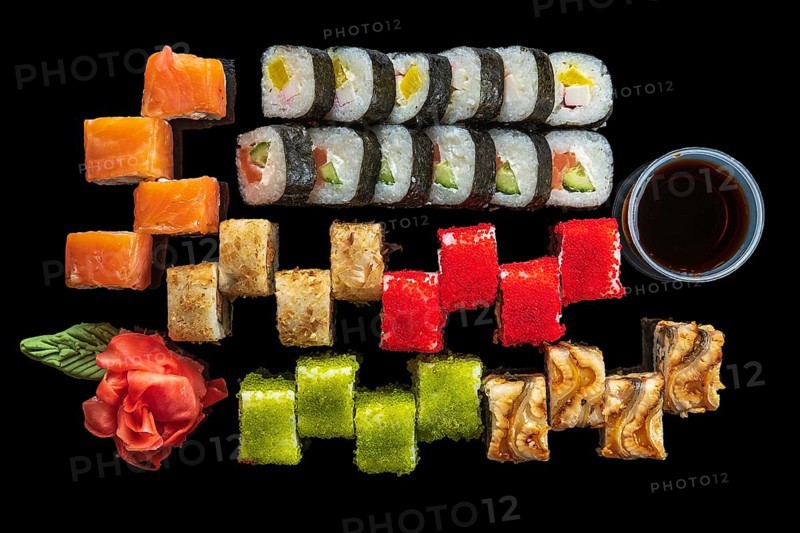 Top view of big set of rolls on black background