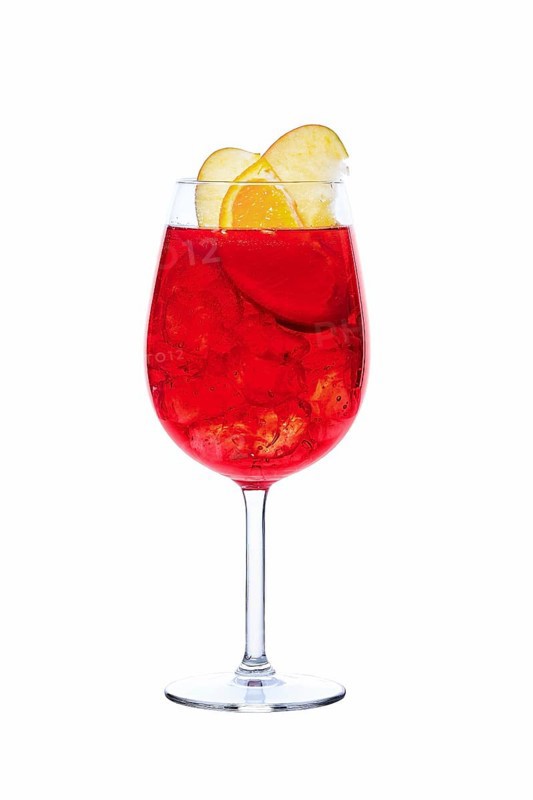Cold sangria in a wine glass isolated on white background