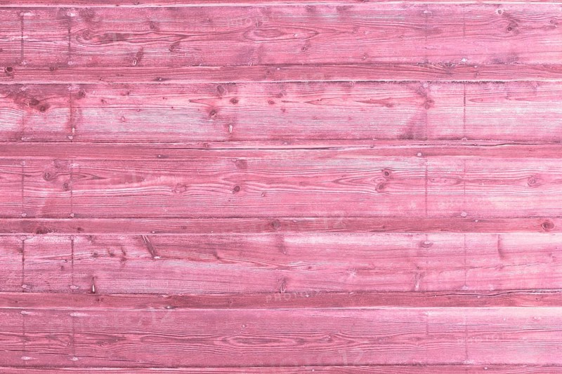 Pink wooden background with old painted planks