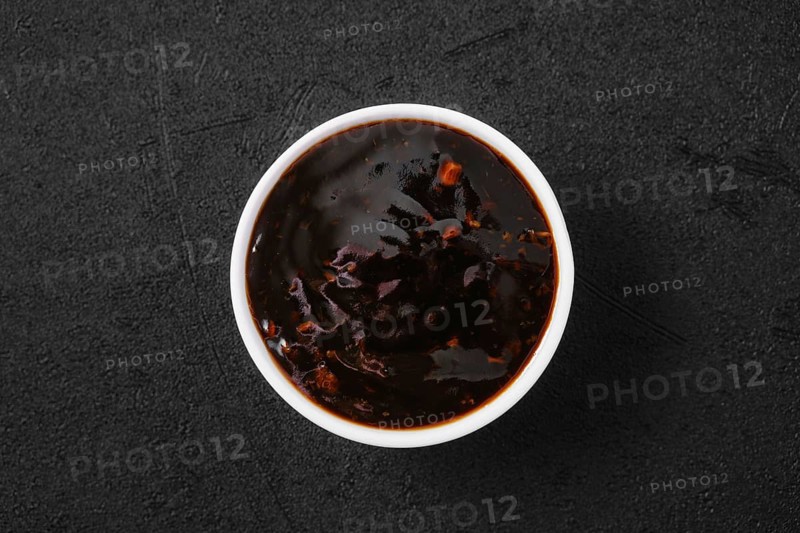 Overhead view of small bowl with spicy teriyaki sauce