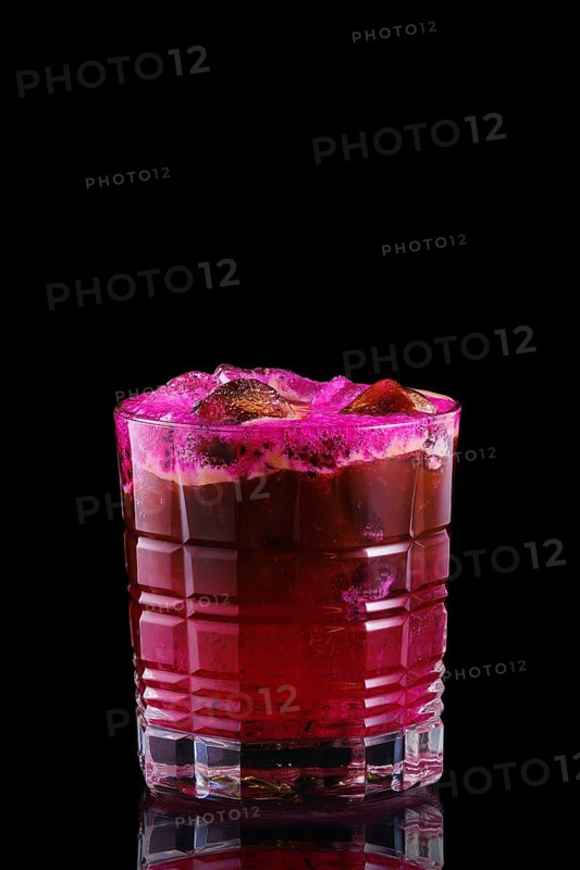 Espresso and tonic with pitaya syrup on black background