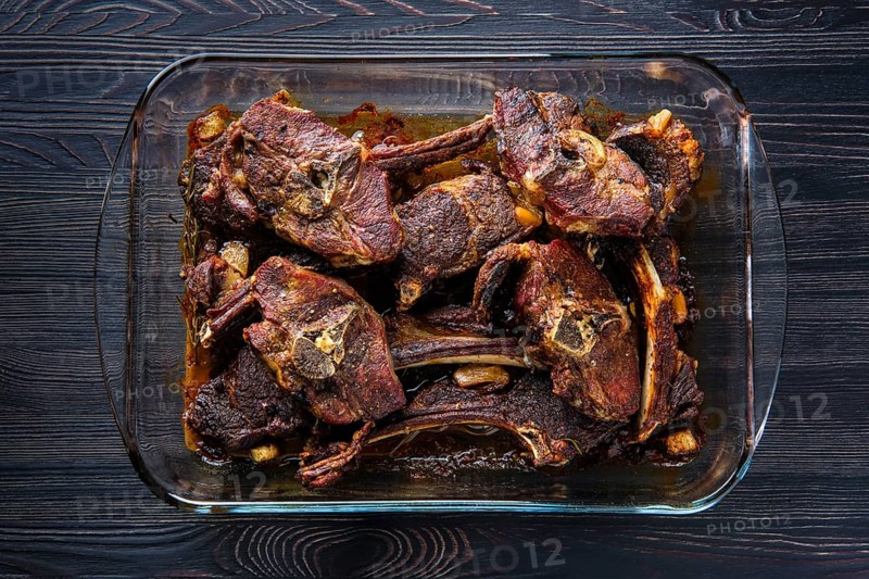 Top view of lamb meat baked in oven