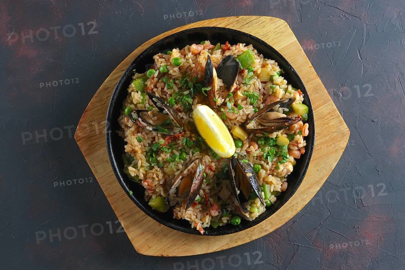 Top view of traditional spanish paela with shrimps and mussels