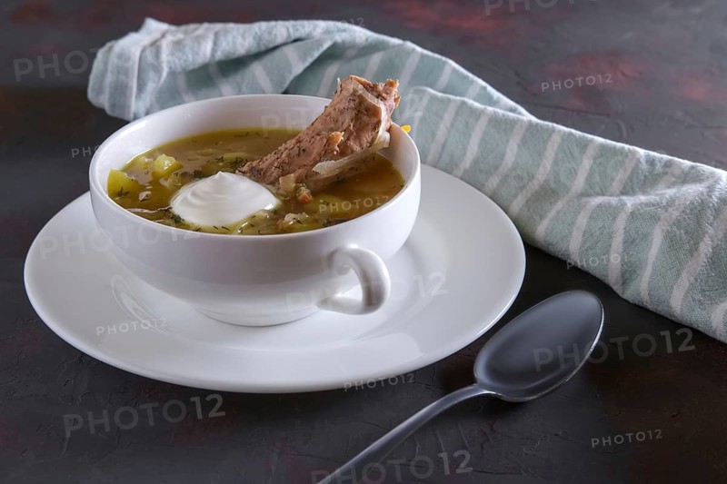 Beef bouillon with meat on a bone
