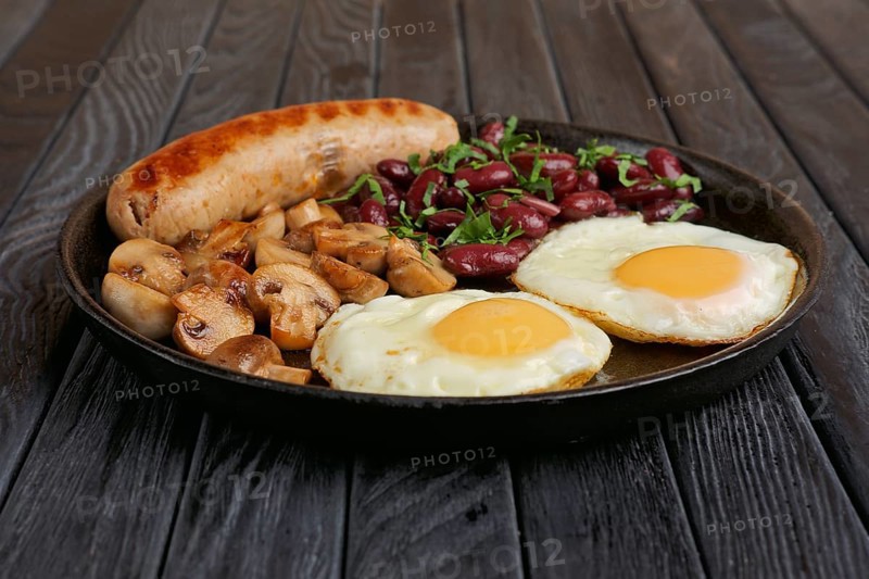 Cast-iron frying pan with fried eggs