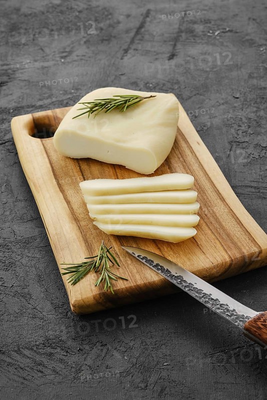 Homemade country style goat cheese on cutting board