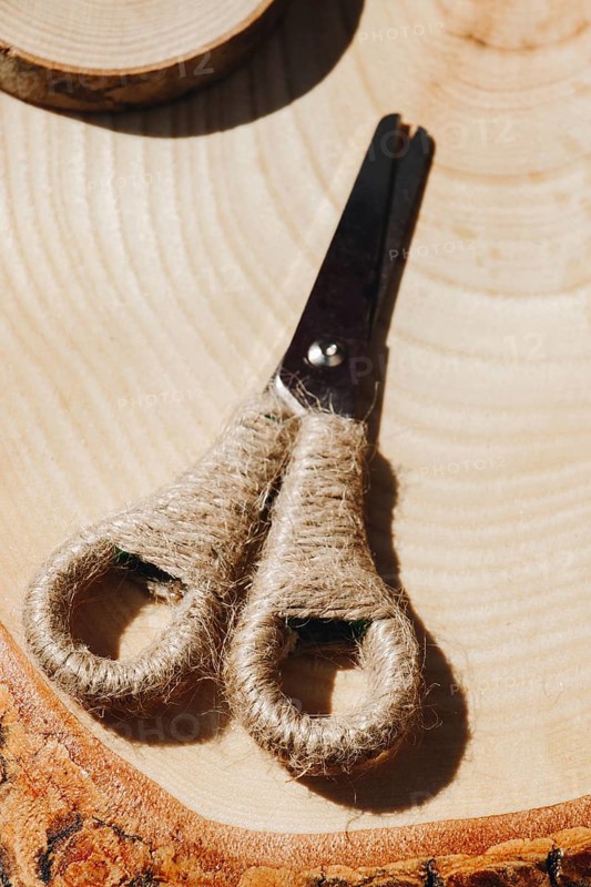 Metal scissors with wool handle in the view