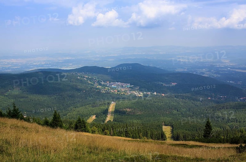 View from the mountains to the city in the background