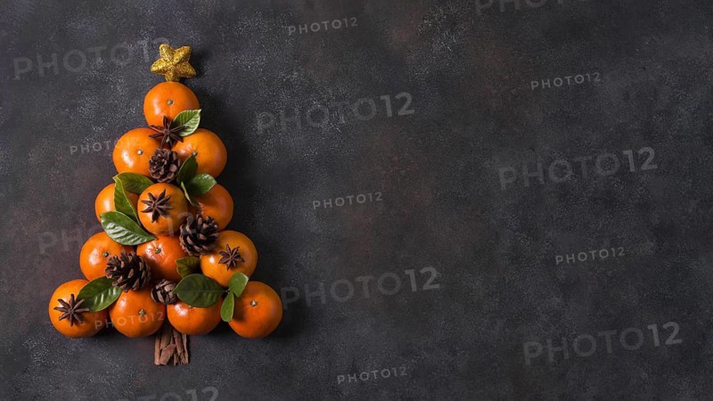 Top view of christmas tree shape made of tangerines and pine cones with copy space. Resolution and high quality beautiful photo