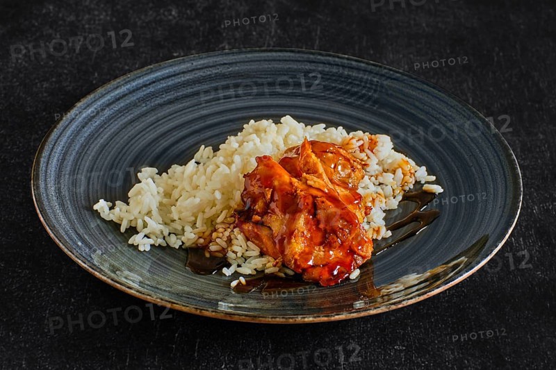 Baked chicken fillet with rice and barbecue sauce