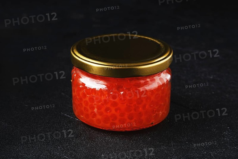 Pot with pink salmon red caviar