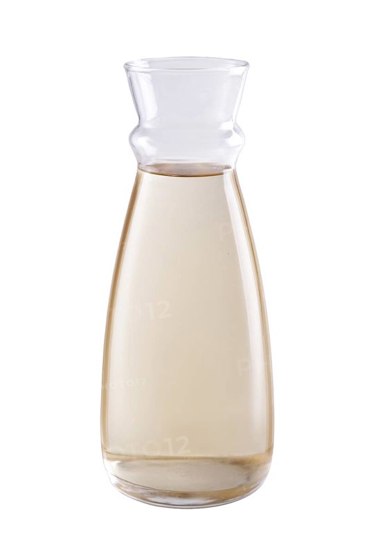 Pitcher with white wine isolated on white