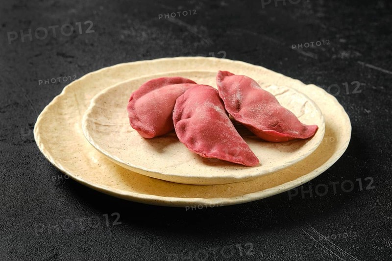 Concept of delivery of semifinished food. Sweet dumplings stuffed with cherry and frozen