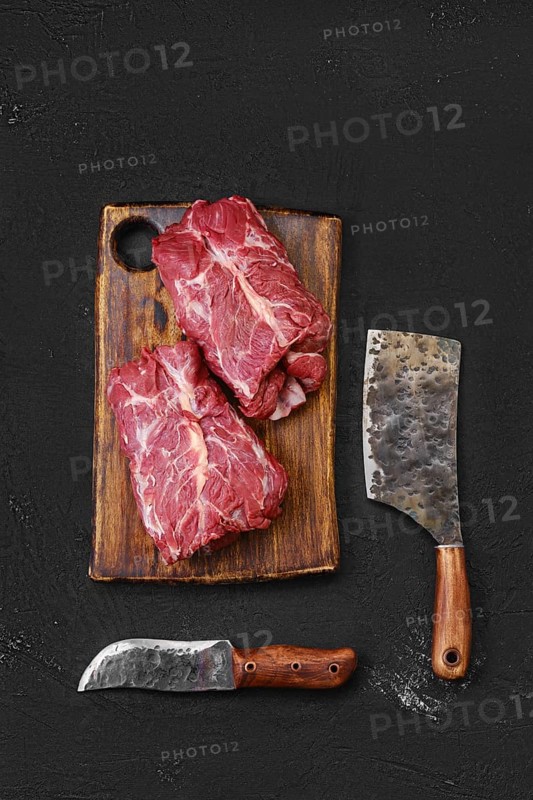 Overhead view of raw fresh lamb boneless neck meat on cutting board