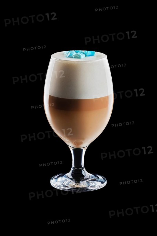 Big transparent glass with layered latte isolated on black background
