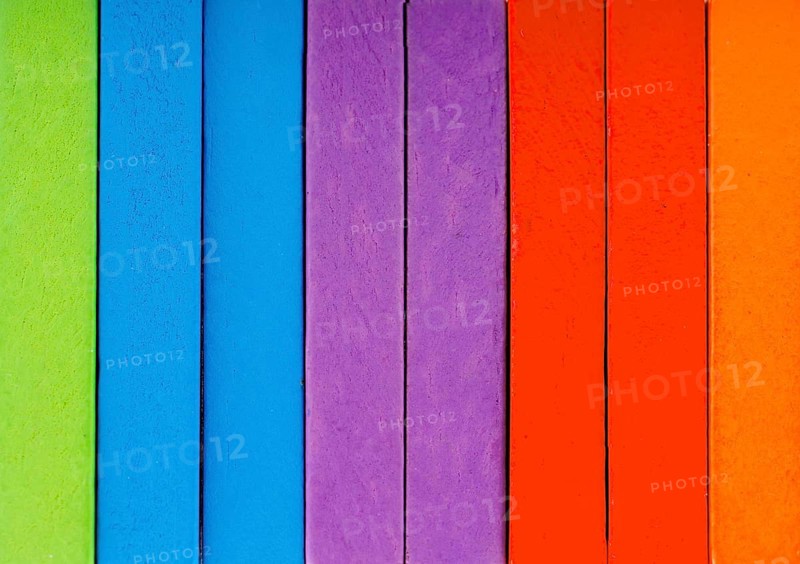 Colorful Domino Blocks in a line on a white background
