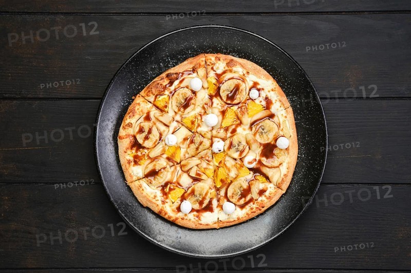 Top view of sweet pie with banana
