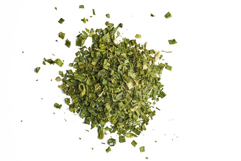 Heap of dry scallion on white background