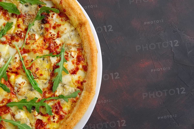 Top view of four cheeses delicious pizza with thick crust
