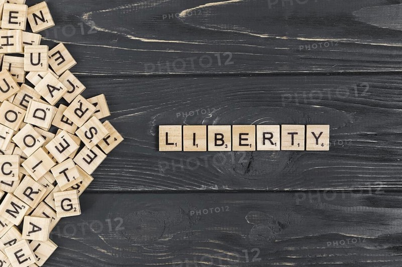 Liberty word wooden background