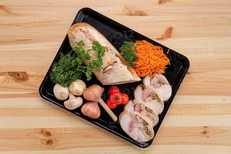 Meatloaf with mushrooms served with spicy carrot