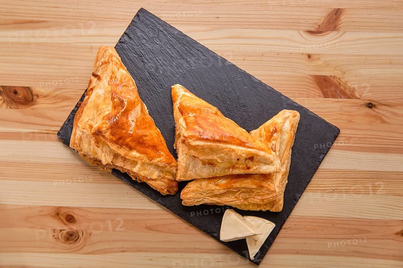 Puff pastry with cheese on slate plate