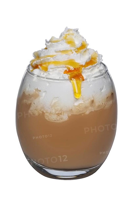 Transparent glass of coffee cocktail with whipped cream and syrup