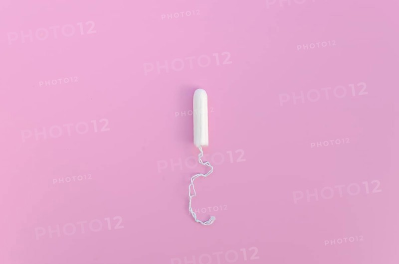 Minimalist tampon pink background top view