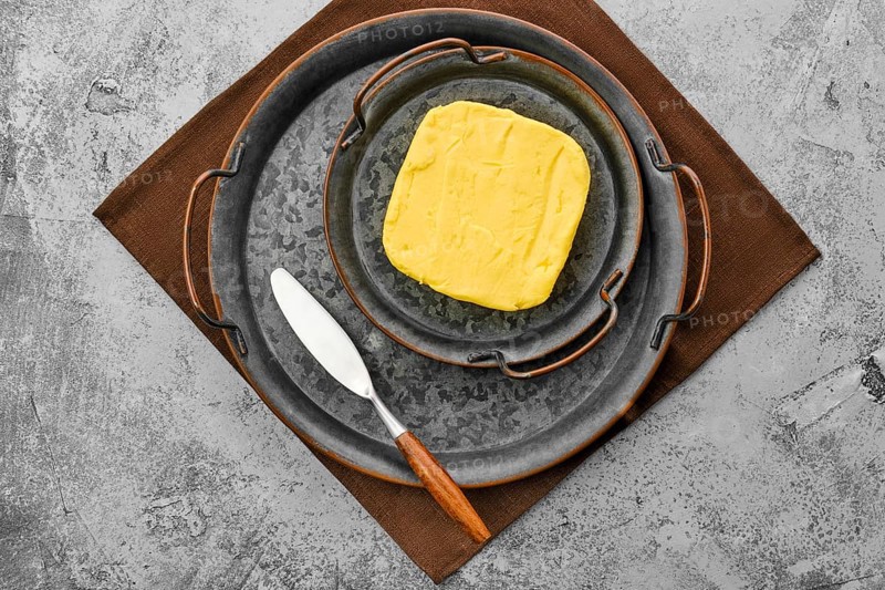 Homemade rustic butter and a spreading knife