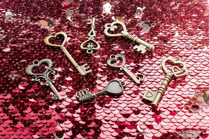 Heart shaped retro metal keys on bright background