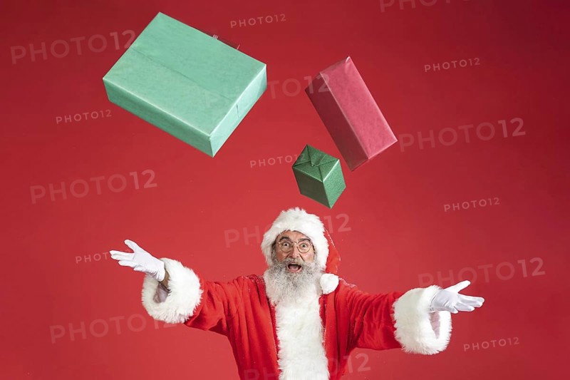 Man santa costume throwing gifts air