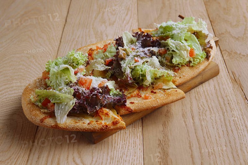 Freshly baked focaccia with salad leaves