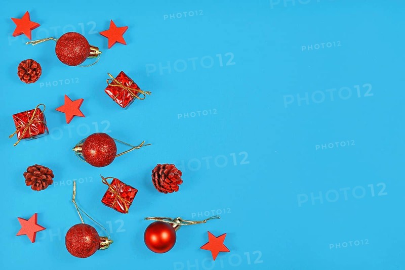 Christmas flat lay with red ornaments in shape of tree baubles