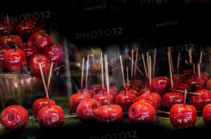 Candy apples are whole apples covered in a hard toffee or sugar candy coating