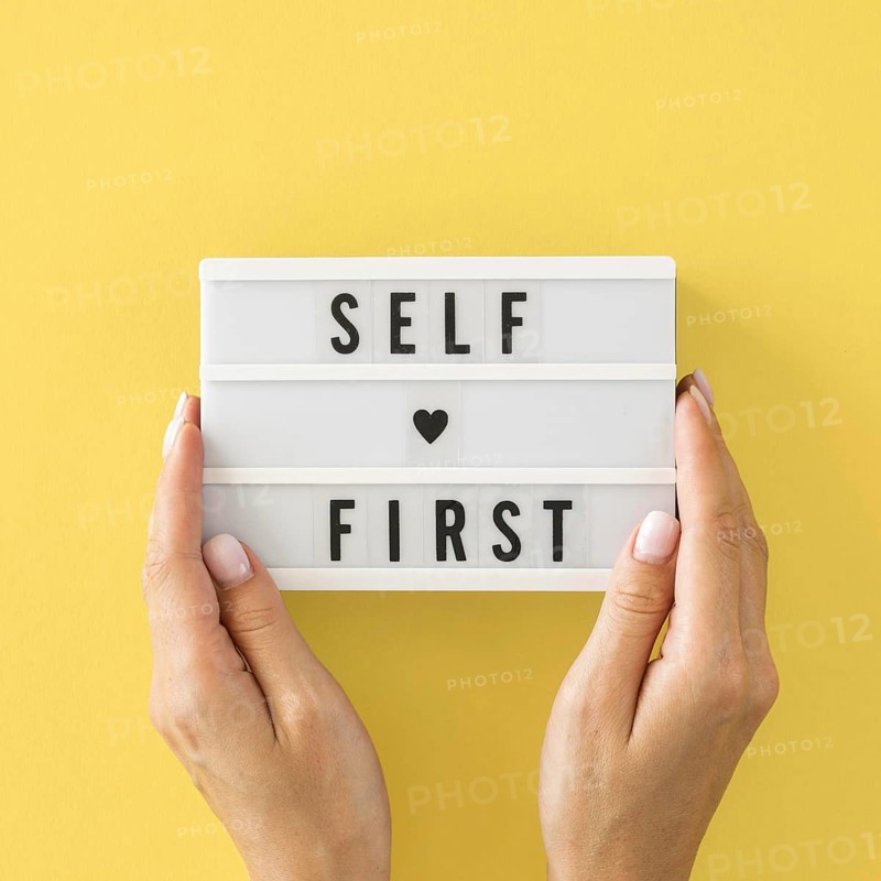 Close up hands holding message board