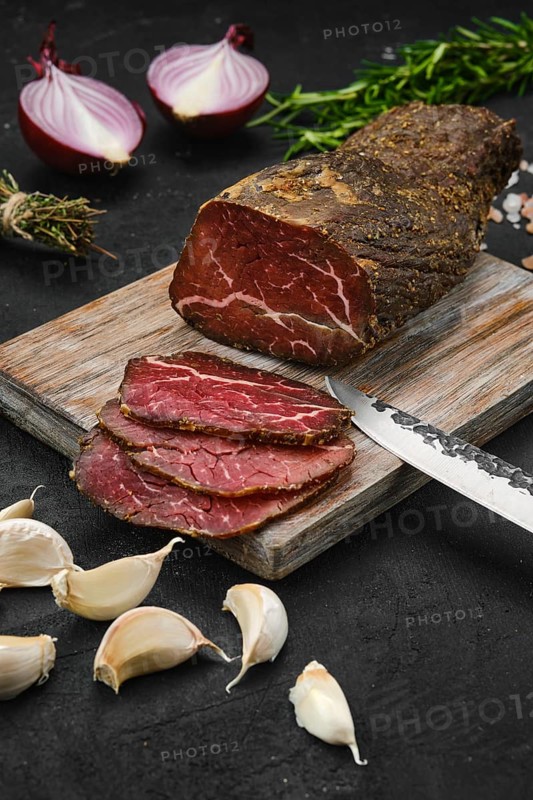 Beef jerky on wooden cutting board