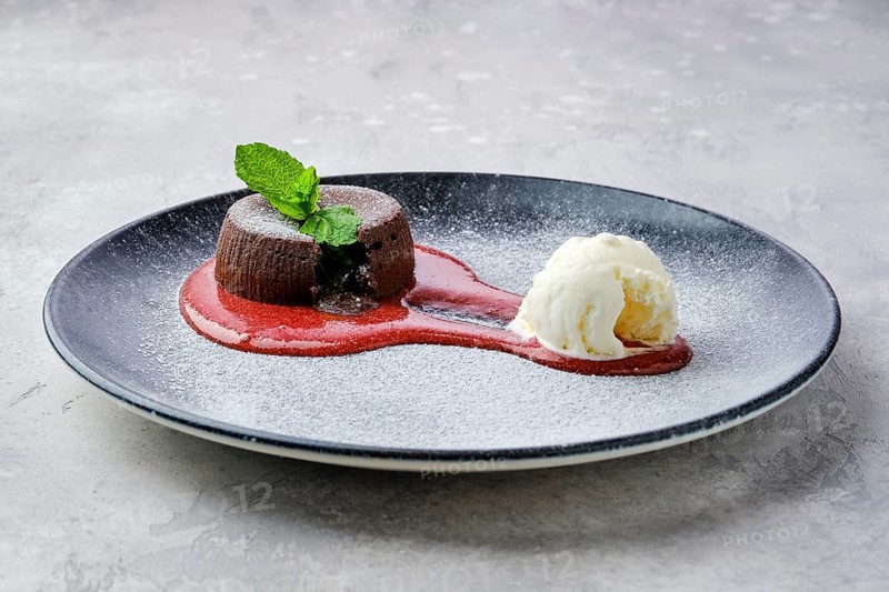 Classic chocolate fondant with ice cream on a plate