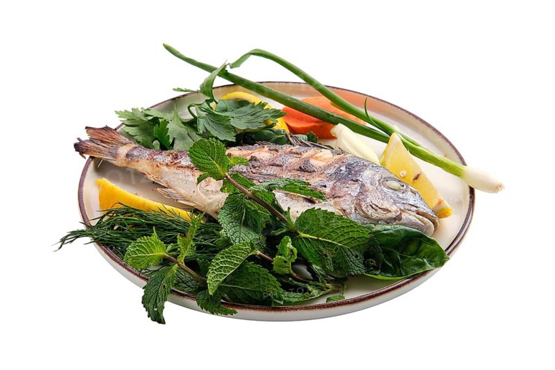 Fried dorada on plate isolated on white background
