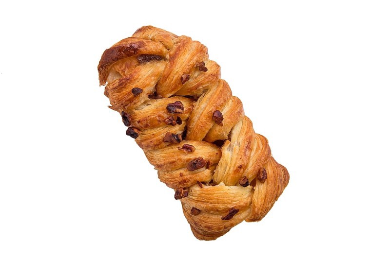 Puff pastry raisin bun isolated on white