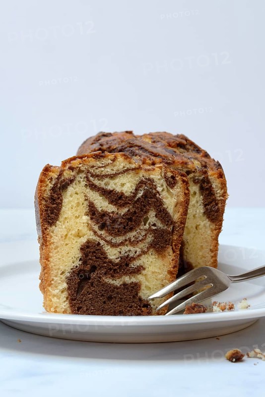 Marble cake with cake fork on plate