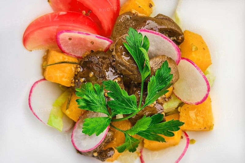 Macro photo of salad with fried chicken liver
