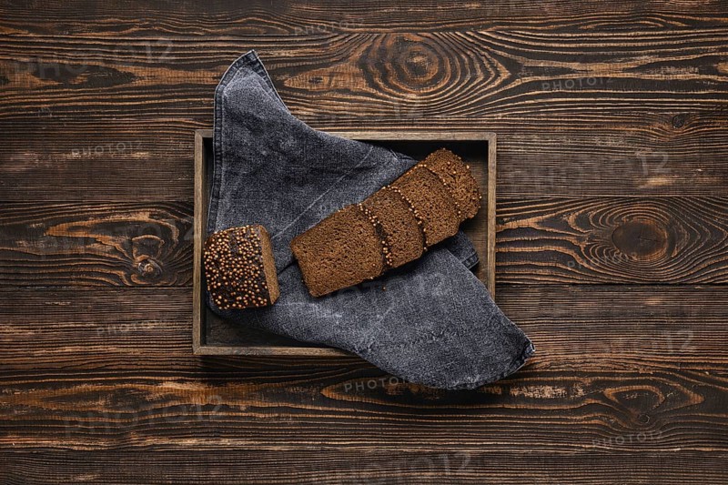 Fresh rye brown bread on wooden cutting board